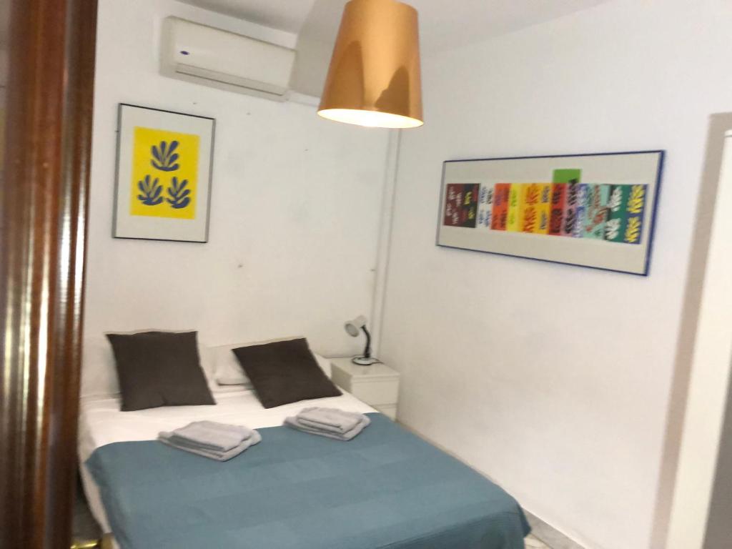 Posteľ alebo postele v izbe v ubytovaní Apartamento centro Malaga Calle Beatas