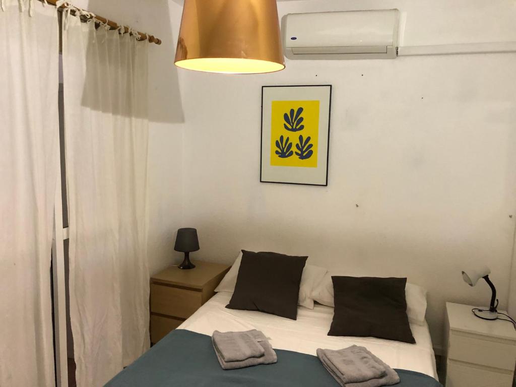 Posteľ alebo postele v izbe v ubytovaní Apartamento centro Malaga Calle Beatas