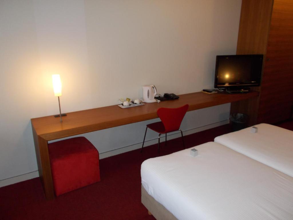 Postel nebo postele na pokoji v ubytování Hotel Corbie Lommel