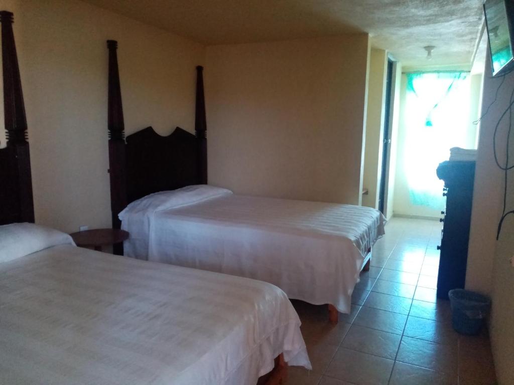 Postel nebo postele na pokoji v ubytování Hotel Cipreses