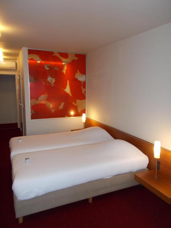 Postel nebo postele na pokoji v ubytování Hotel Corbie Lommel