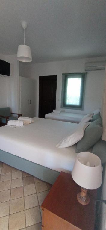 Posteľ alebo postele v izbe v ubytovaní Raptis Aparthotel Sivota