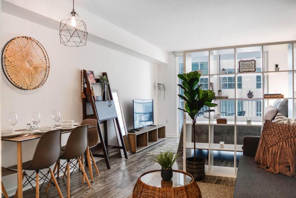 a living room with a table and a dining room at Amazing Studio Apt @BRICKELL With pool & Parking in Miami