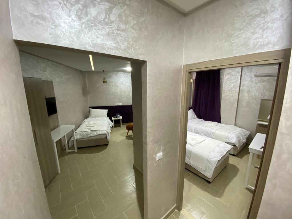 Postel nebo postele na pokoji v ubytování Hôtel Chark