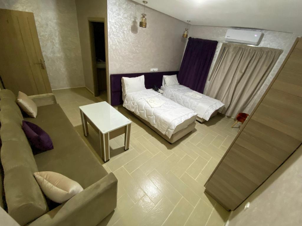 Postel nebo postele na pokoji v ubytování Hôtel Chark