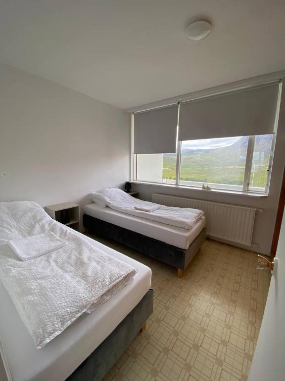 Postel nebo postele na pokoji v ubytování Dúfan Apartments