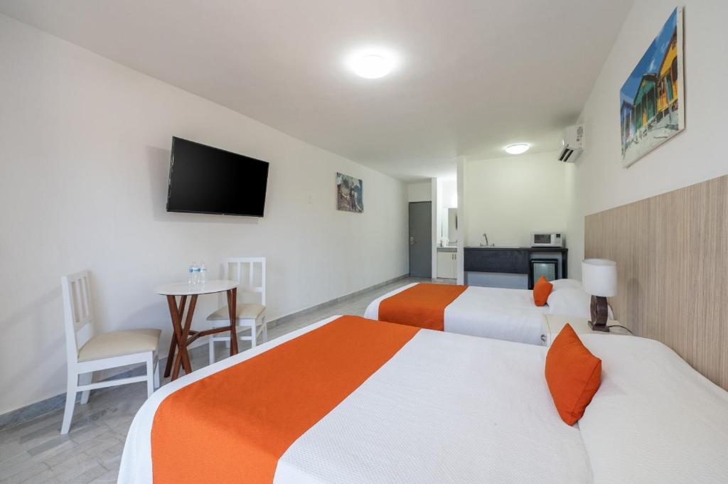 Postel nebo postele na pokoji v ubytování Hotel Imperial Laguna Faranda Cancún