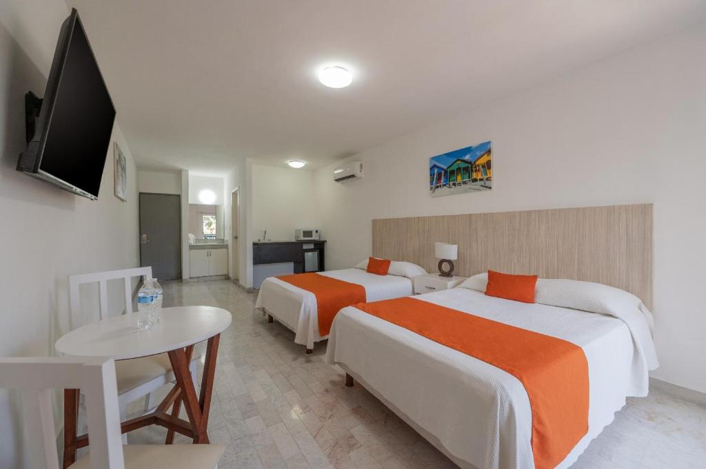 Postel nebo postele na pokoji v ubytování Hotel Imperial Laguna Faranda Cancún