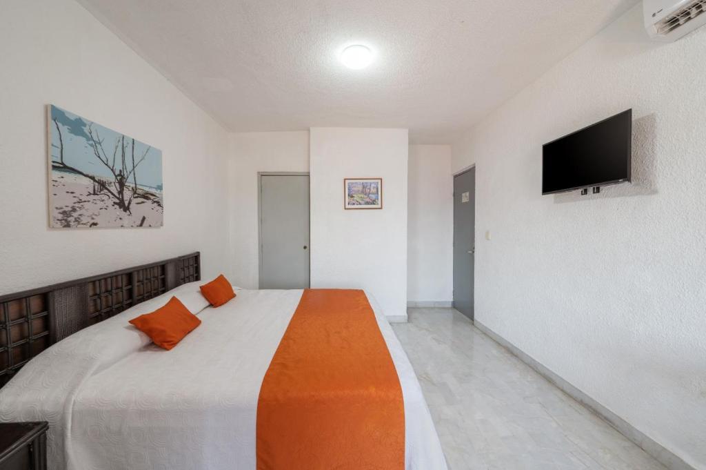 Postel nebo postele na pokoji v ubytování Hotel Imperial Laguna Faranda Cancún