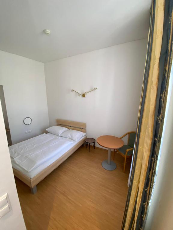 Postel nebo postele na pokoji v ubytování Kolbeck Rooms