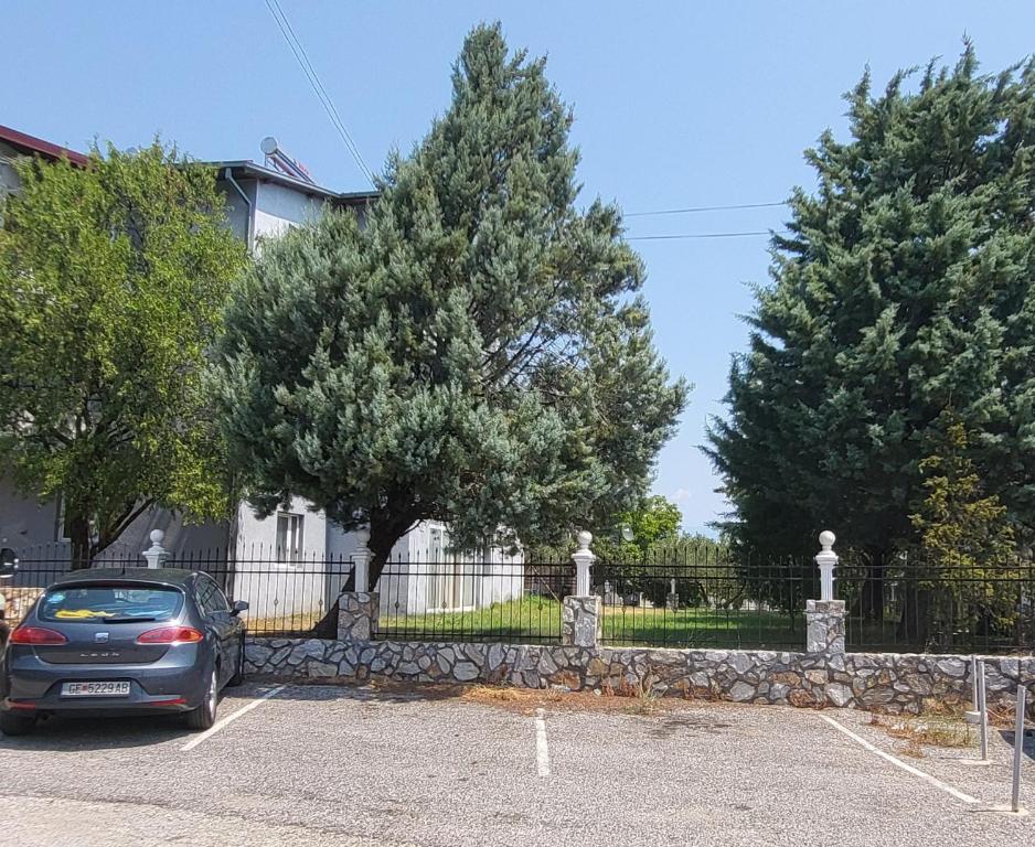 a car parked in a parking lot in front of a fence at Apartment N.1 in Nov Dojran