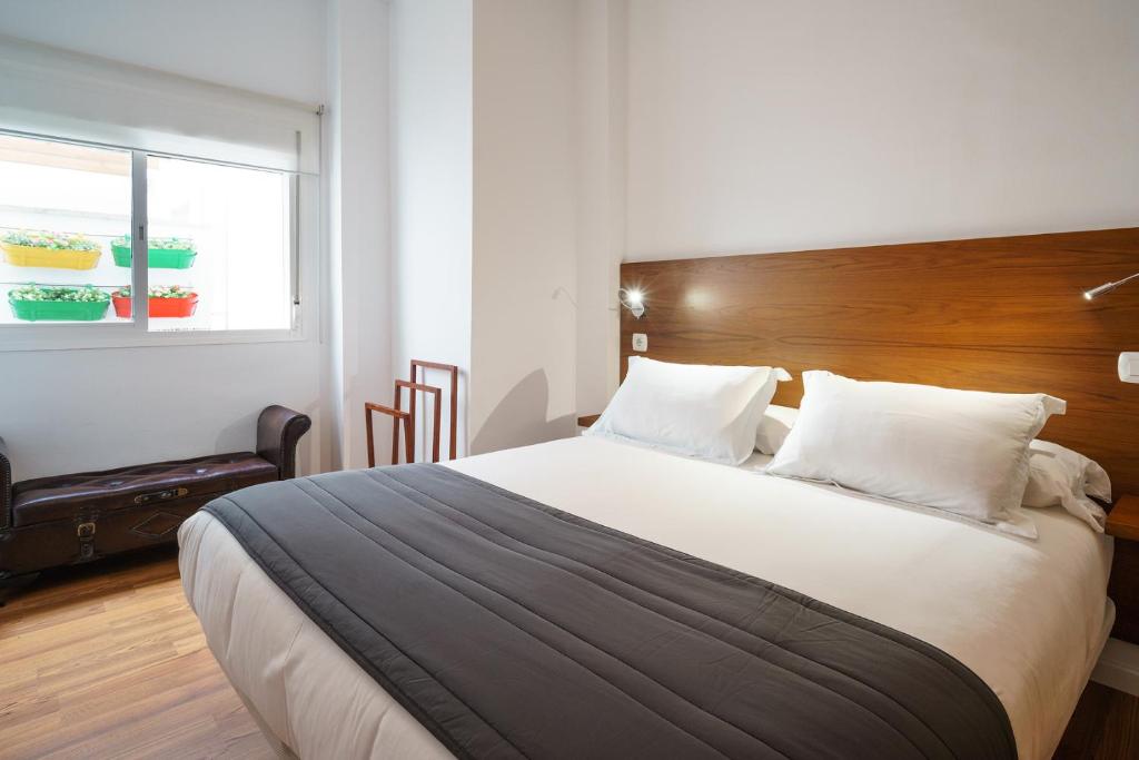 Posteľ alebo postele v izbe v ubytovaní Minimal Rooms by ELE Apartments