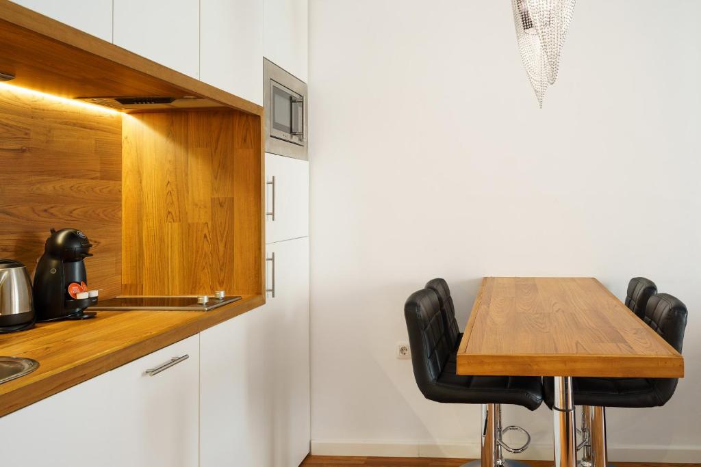 Kuchyňa alebo kuchynka v ubytovaní Minimal Rooms by ELE Apartments