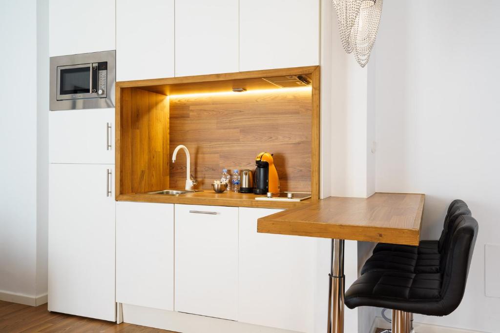 Kuchyňa alebo kuchynka v ubytovaní Minimal Rooms by ELE Apartments