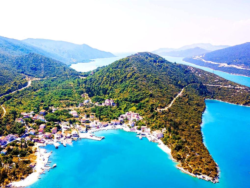 an aerial view of a small island in the water at Holiday Home By The Sea--Bougainvillea in Ston