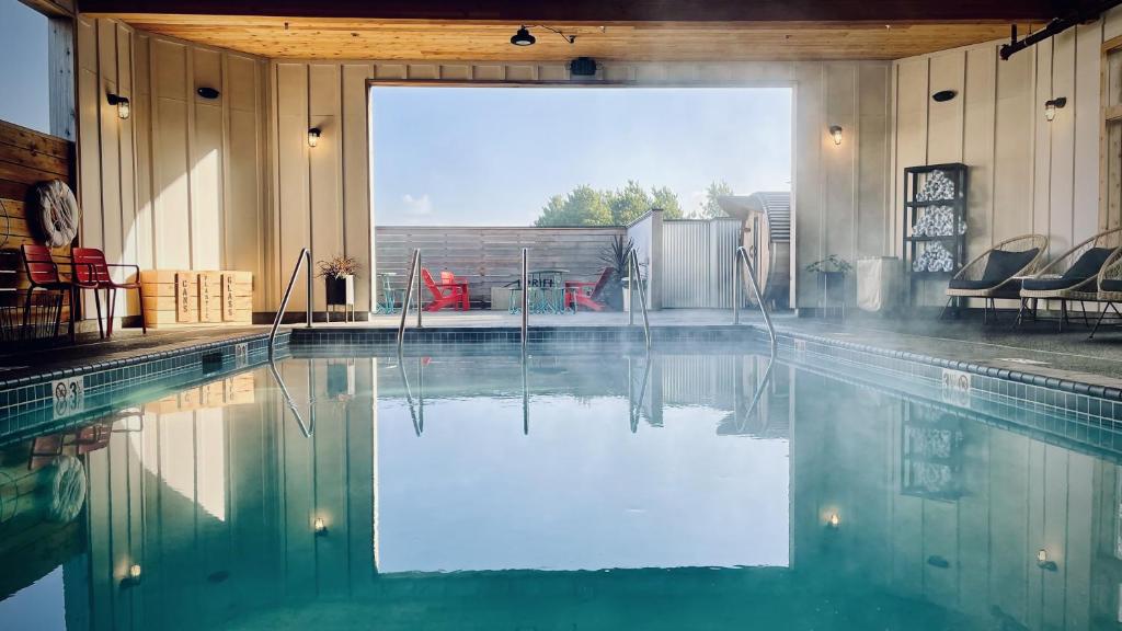 a swimming pool in a building with a pool at Inn at Discovery Coast in Long Beach