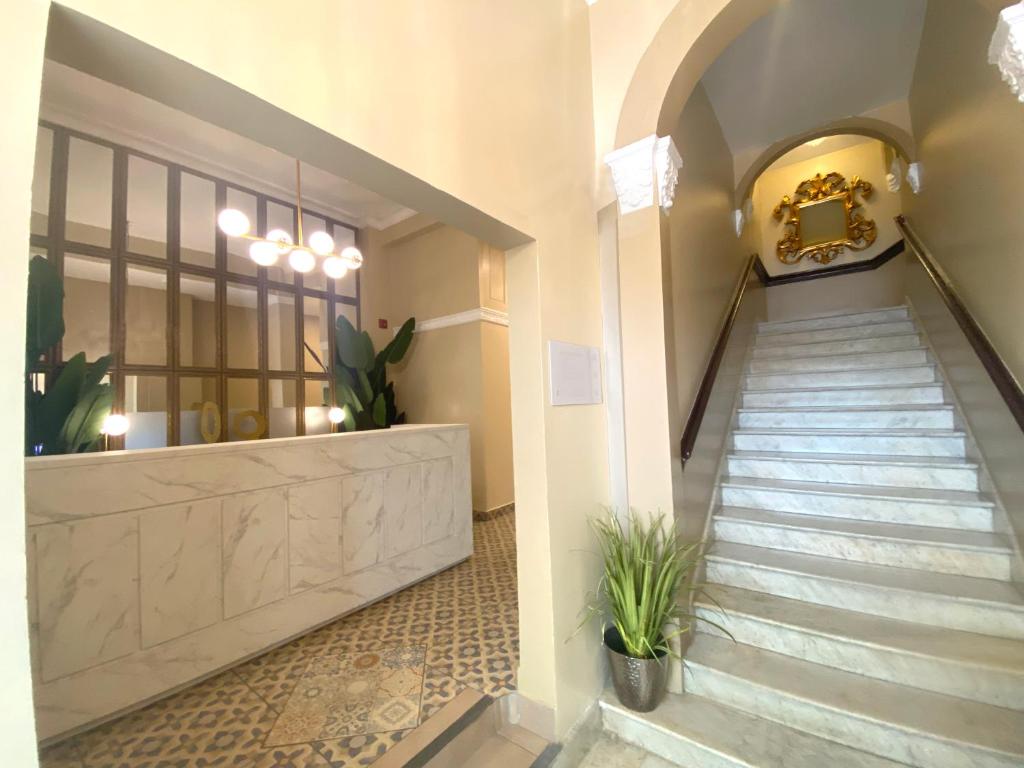 a hallway with a staircase in a building at Magnolia Inn in Panama City