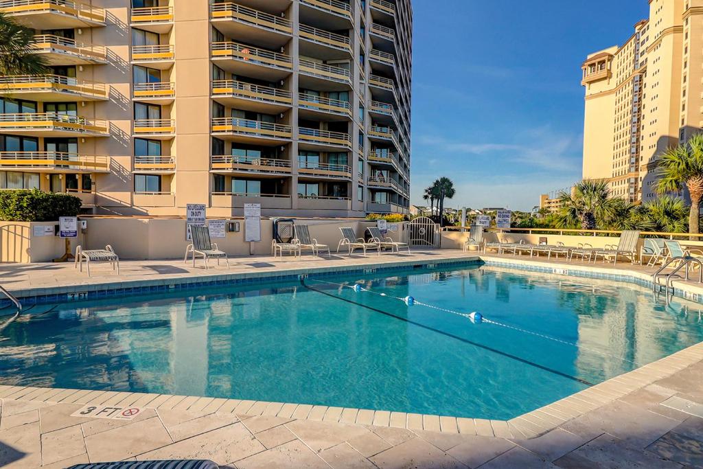 a large swimming pool in front of a building at Ocean Creek in Myrtle Beach