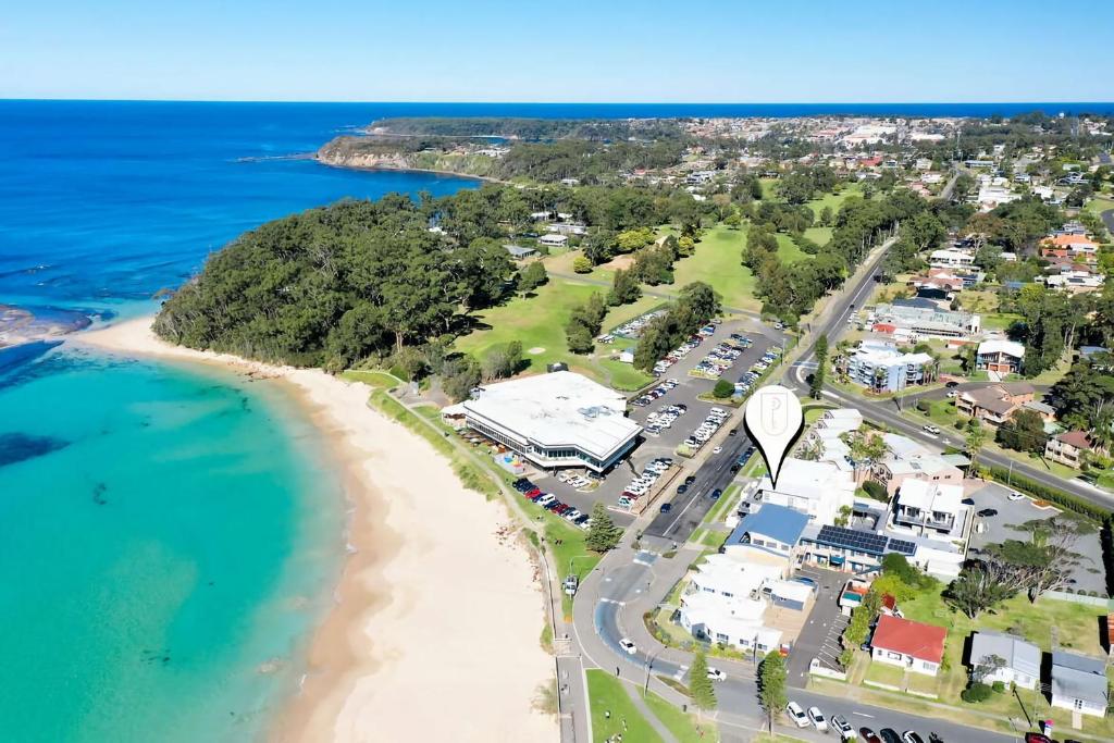 an aerial view of a beach and the ocean at Beachfront Four in Mollymook