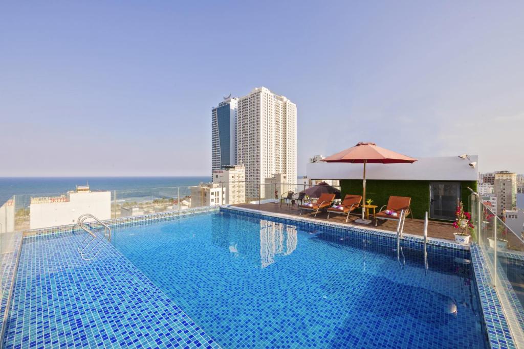 a large swimming pool on top of a building at Helios Boutique Hotel & Spa in Da Nang