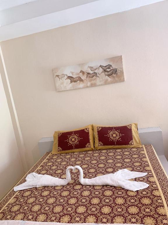 Ein Bett oder Betten in einem Zimmer der Unterkunft Sabye~Sabye