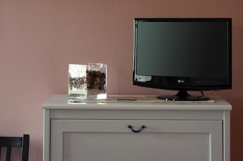TV a/nebo společenská místnost v ubytování B&B LA Garzetta