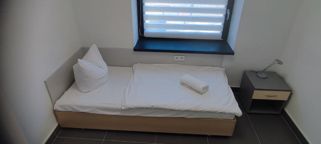 Posteľ alebo postele v izbe v ubytovaní WOSiR Drzonków