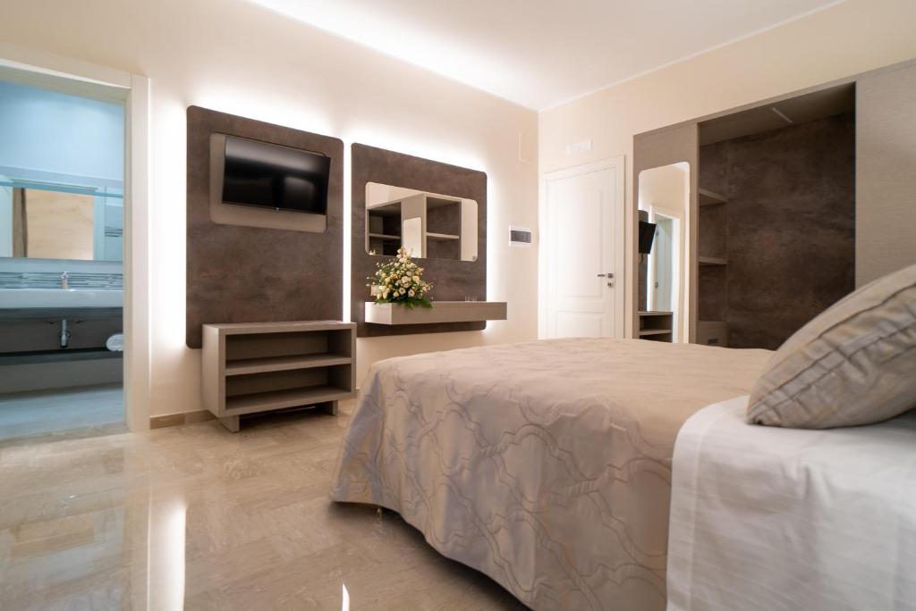 Postel nebo postele na pokoji v ubytování Le margherite B&B