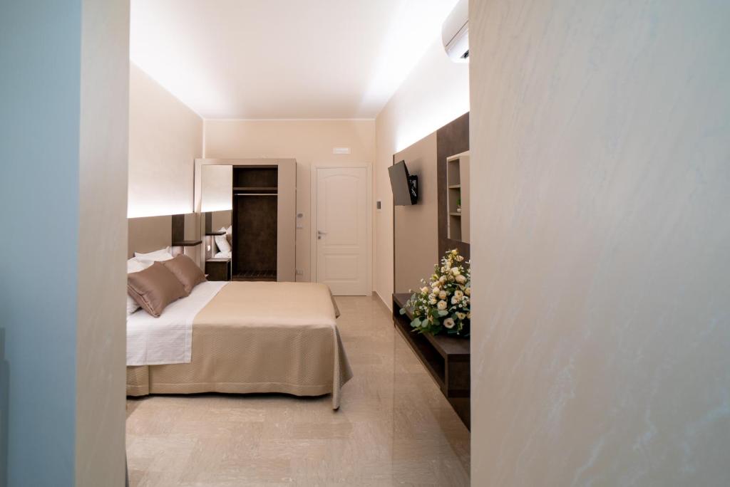 Postel nebo postele na pokoji v ubytování Le margherite B&B
