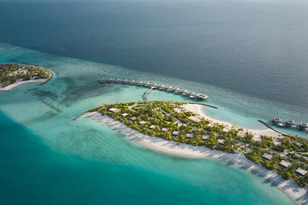 an aerial view of an island in the ocean at Patina Maldives, Fari Islands in North Male Atoll