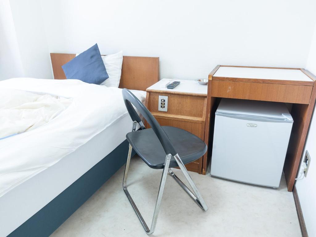 Postel nebo postele na pokoji v ubytování Tabist Business Hotel Kanazono Gifu