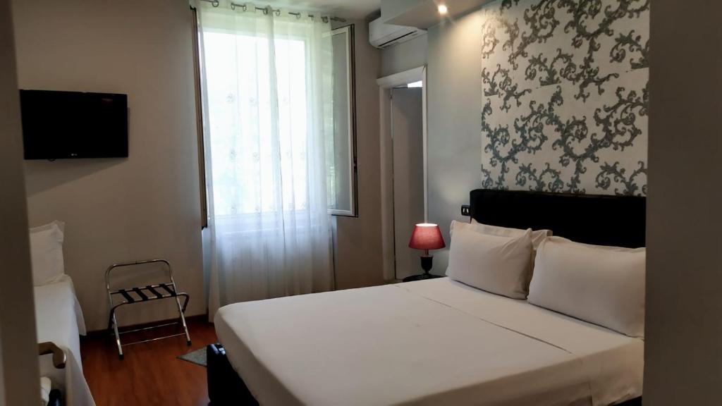 Postel nebo postele na pokoji v ubytování Il Roseto