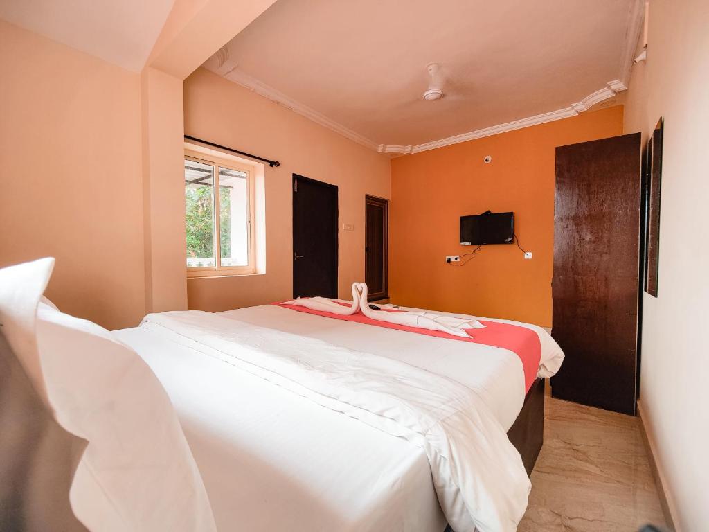 Postel nebo postele na pokoji v ubytování Hotel Candolim Aloft
