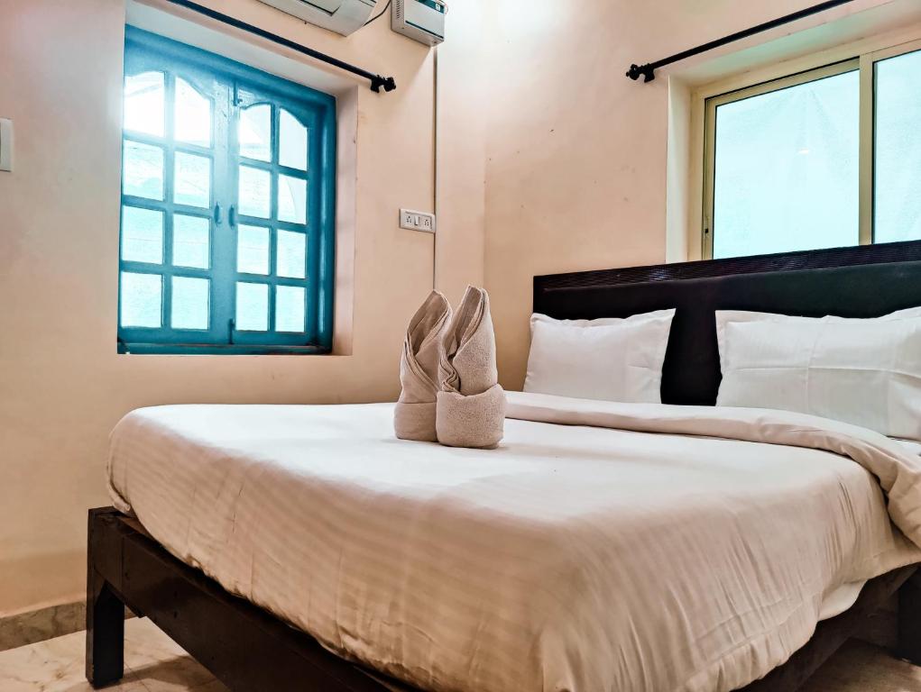 Postel nebo postele na pokoji v ubytování Hotel Candolim Aloft
