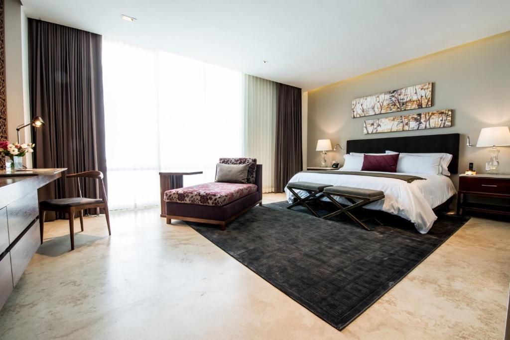 Postel nebo postele na pokoji v ubytování Square Small Luxury Hotel - Providencia