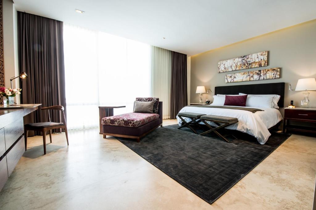 Tempat tidur dalam kamar di Square Small Luxury Hotel - Providencia