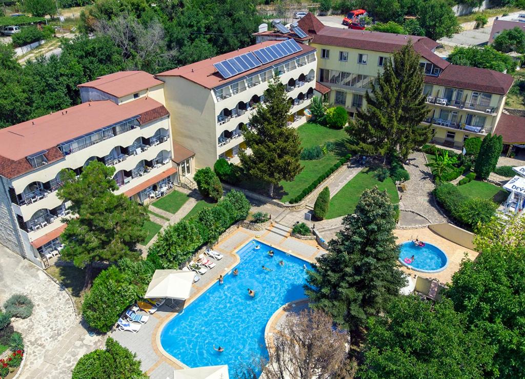 an aerial view of a resort with a swimming pool at Hotel Naslada in Balchik