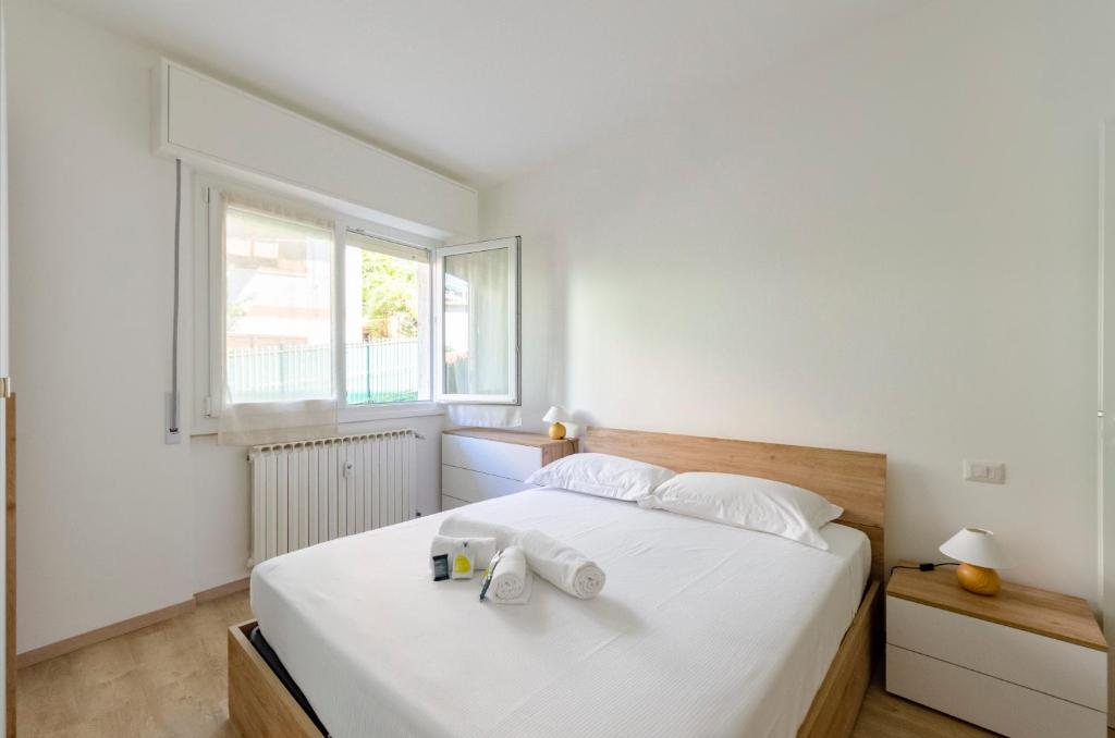 Łóżko lub łóżka w pokoju w obiekcie JOIVY Banfi Apartment