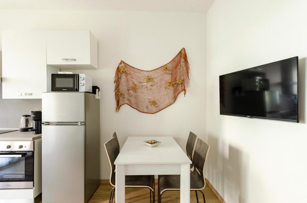 Kuchnia lub aneks kuchenny w obiekcie JOIVY Banfi Apartment