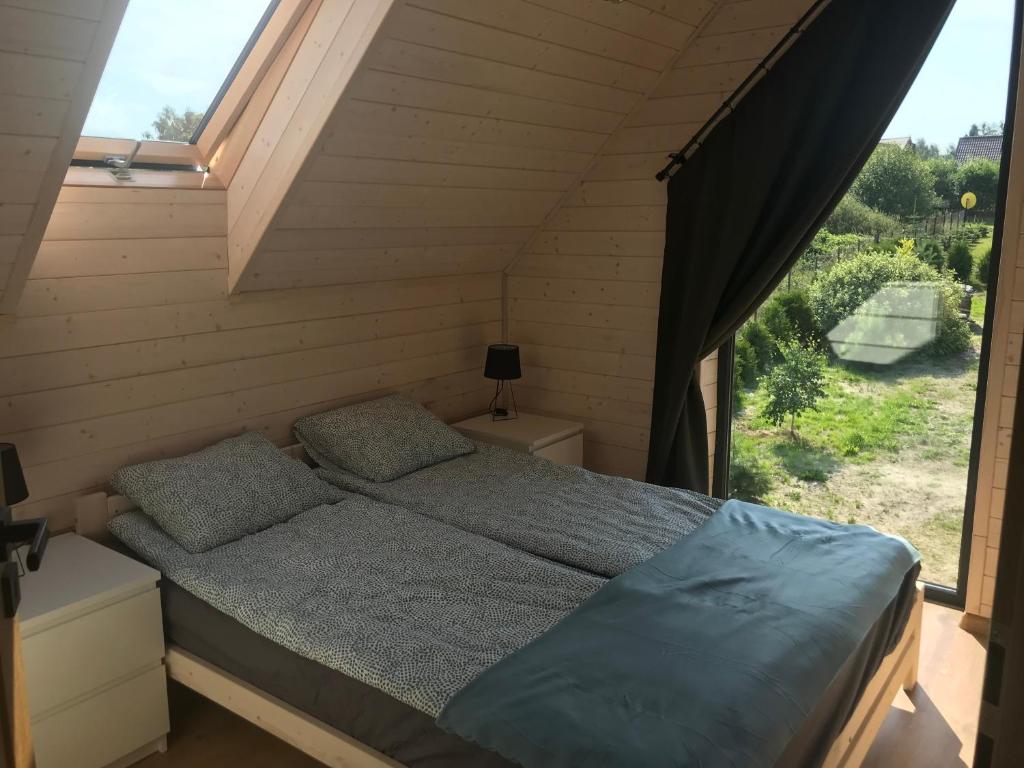 Postel nebo postele na pokoji v ubytování NORBEA Domek na Łąkowej