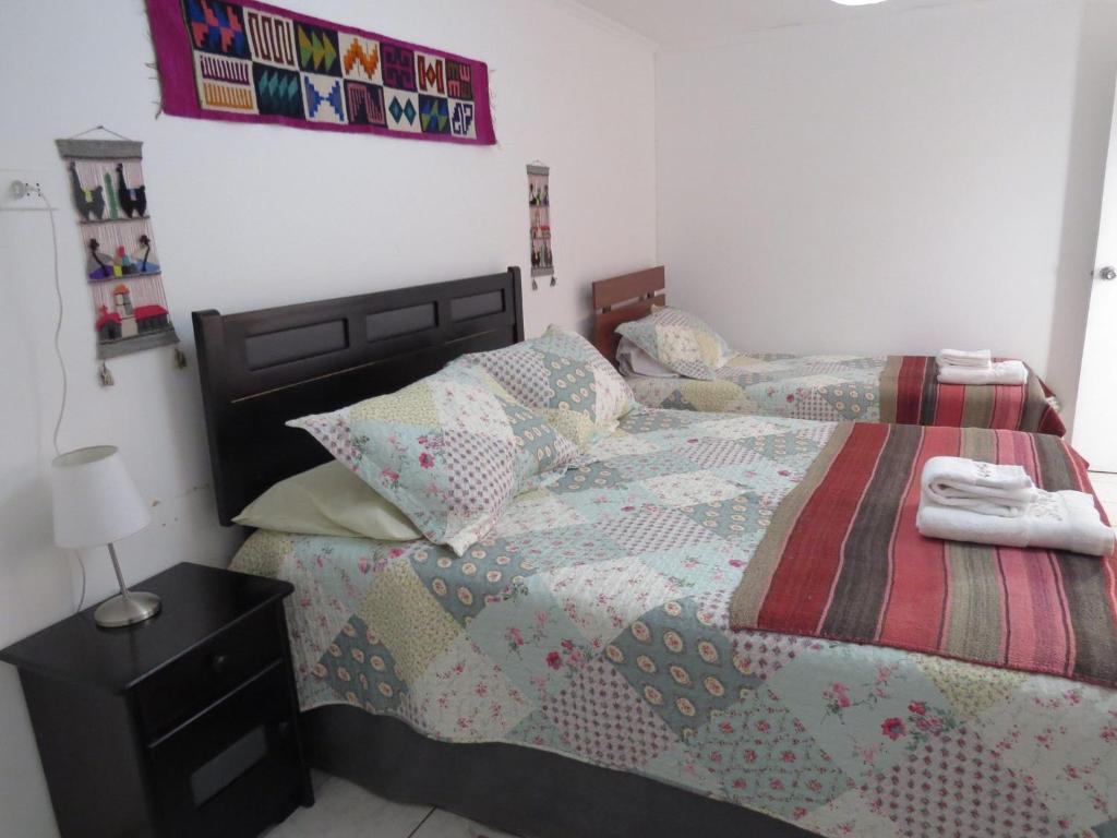 Postel nebo postele na pokoji v ubytování Hostal Kirckir