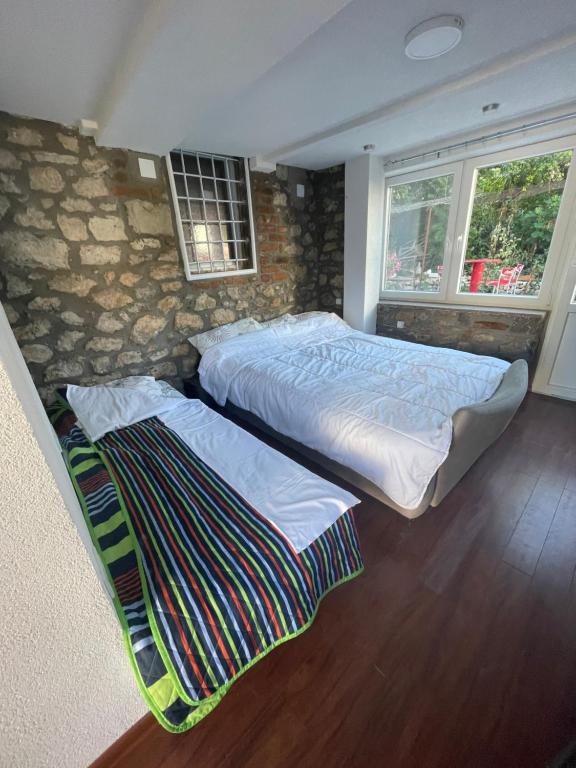 Postel nebo postele na pokoji v ubytování Apartments Surban