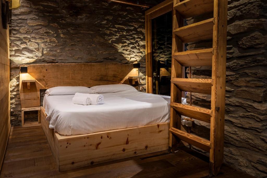 Postel nebo postele na pokoji v ubytování Brieis Relais Alpino