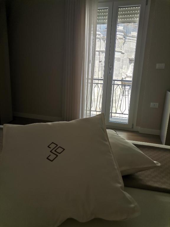 Postel nebo postele na pokoji v ubytování Dimora Donna Dora - Albergo Diffuso