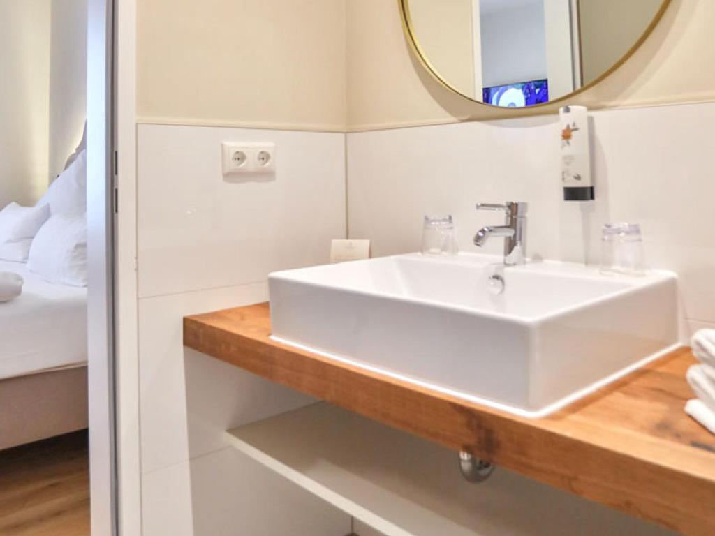 Postel nebo postele na pokoji v ubytování Hotel Tuchhaus