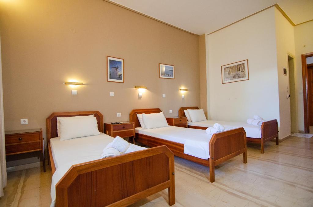 Postel nebo postele na pokoji v ubytování Almira Inn