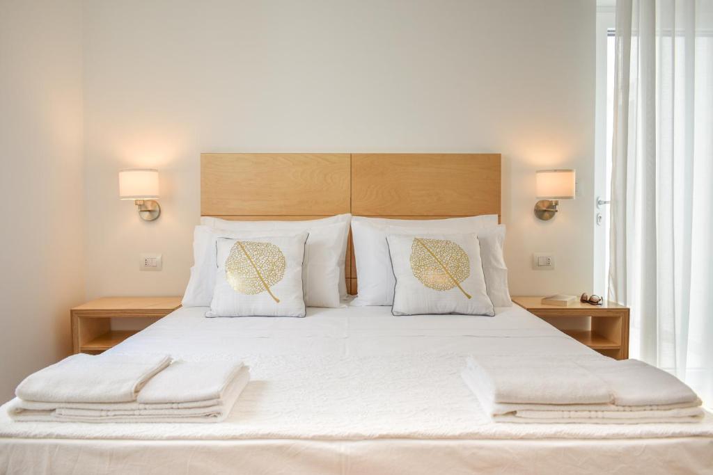 A bed or beds in a room at Ammarèa B&B
