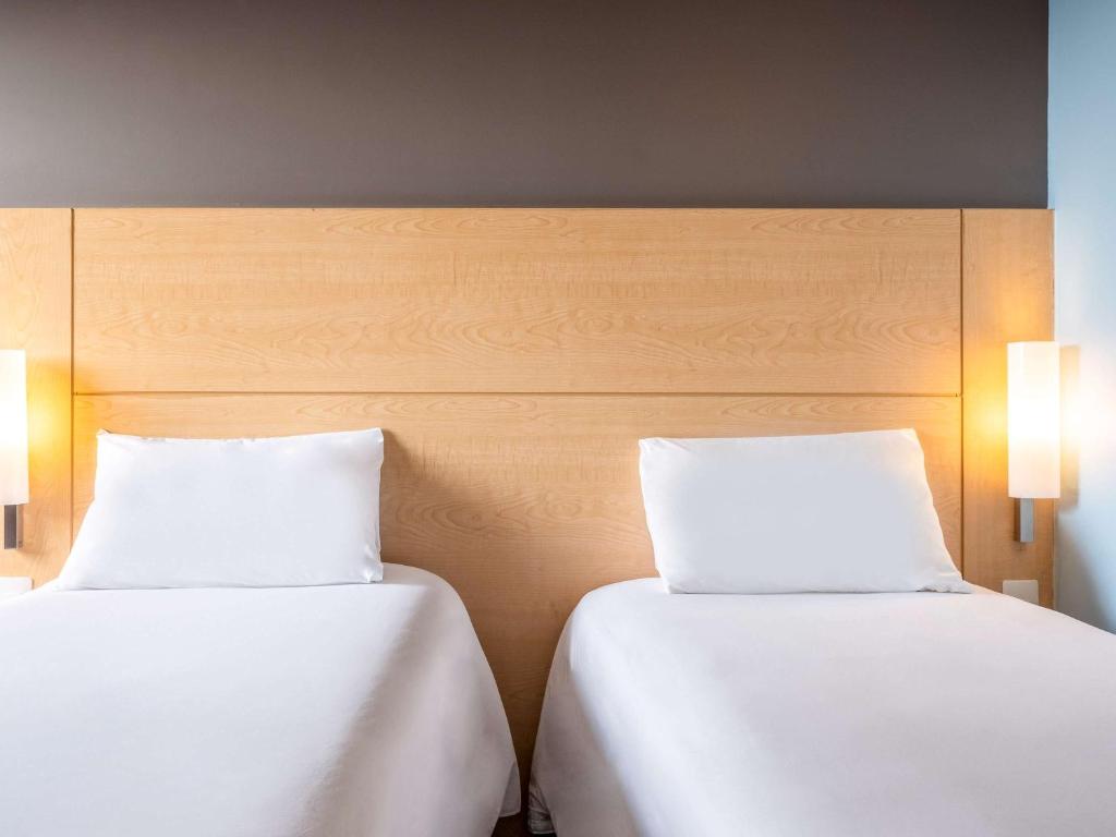 Postel nebo postele na pokoji v ubytování Ibis Chihuahua
