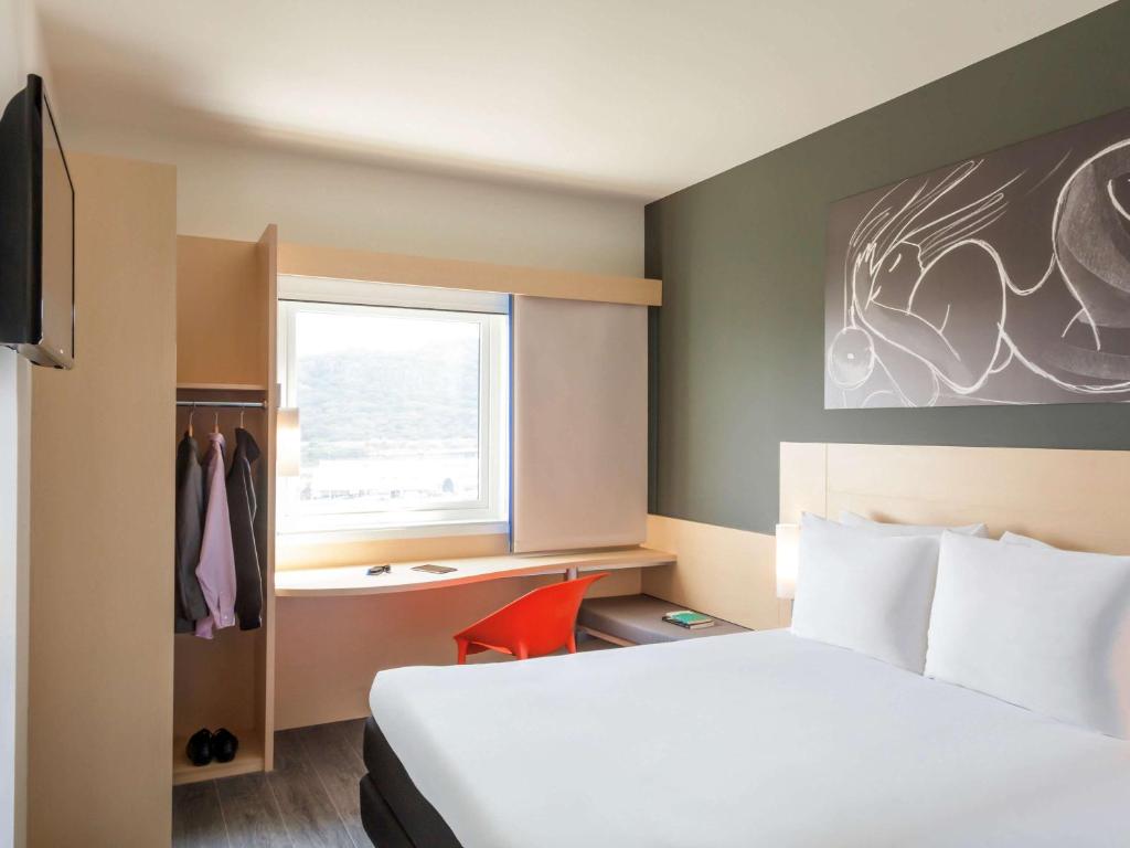 Postel nebo postele na pokoji v ubytování Ibis Queretaro