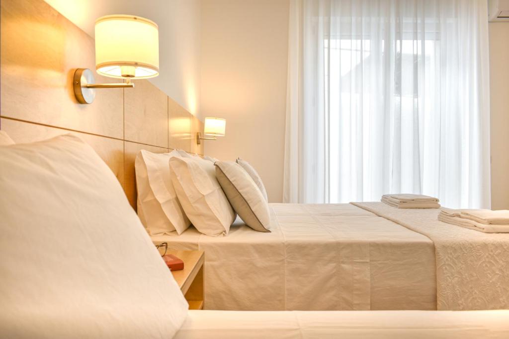 A bed or beds in a room at Ammarèa B&B
